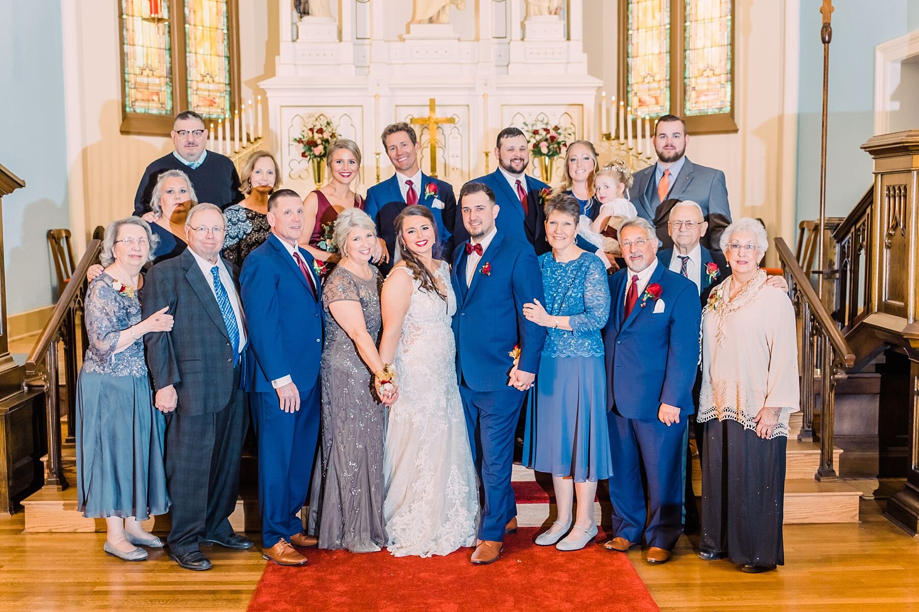 wedding party standing together in a church 