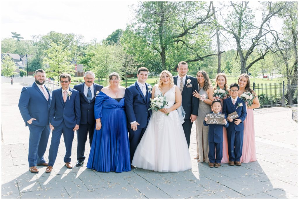 bride and groom with large family