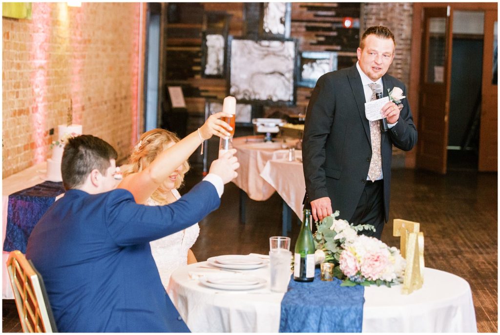 bride and groom toast father