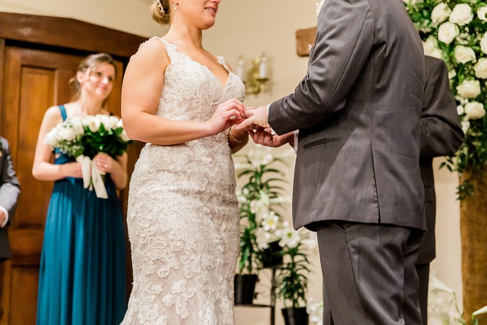 a couple exchanging rings at their wedding
