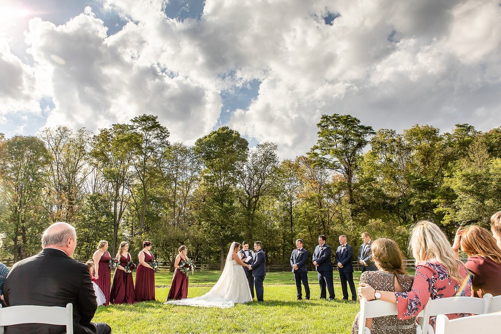 outdoor wedding in front of a forest
