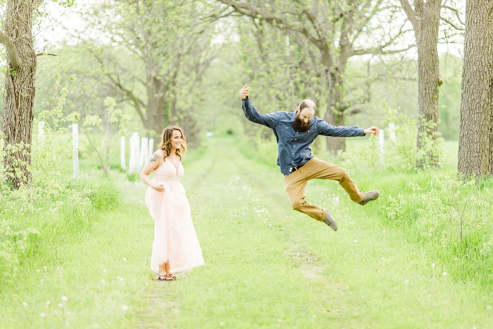 man and woman dancing at their engagement session