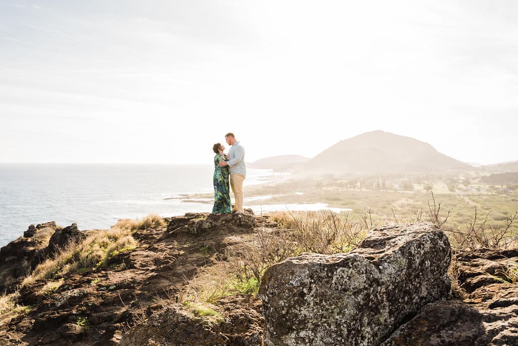 couple standing on oahu mountain vow renewal