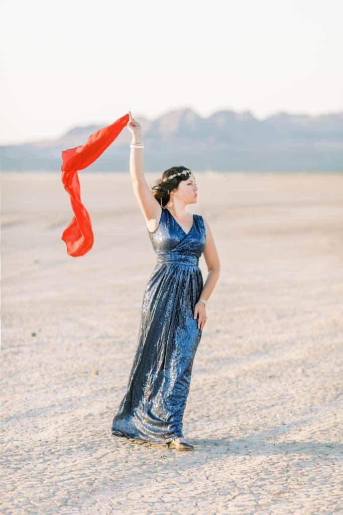 woman standing in a blue dress in el dorado dry lake bed las vegas