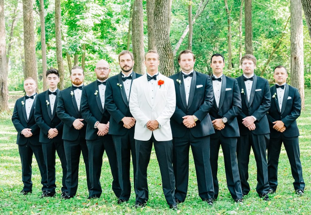 groomsmen standing at black iris estate