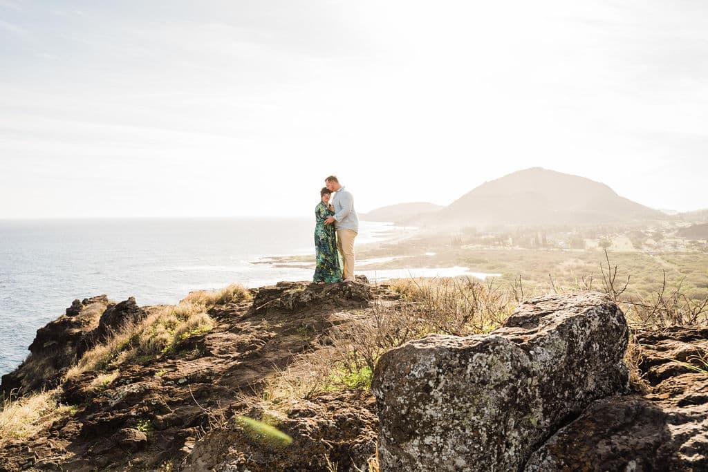 couple standing in hawaii cliff after i just got engaged