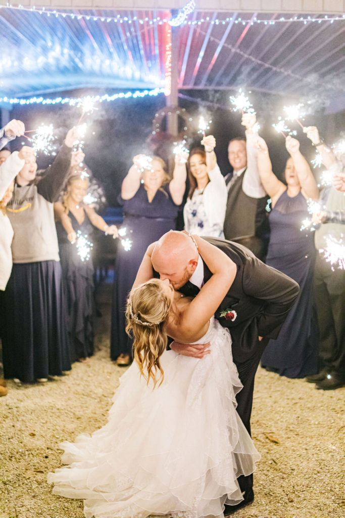 sparkler wedding exit bride and groom kiss