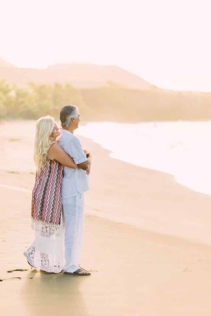 couple elope in maui standing on beach elopement in lahaina